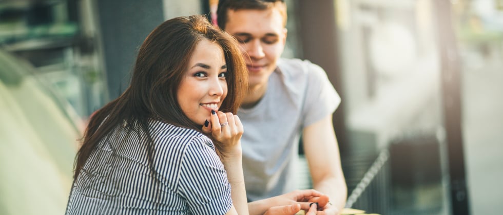Man smiling at woman as a symbol for dating advice for men