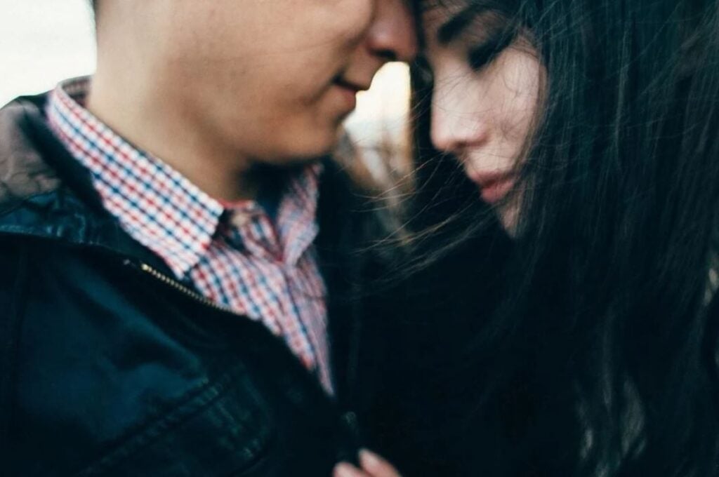 Man and woman forehead to forehead as a symbol of love or lust