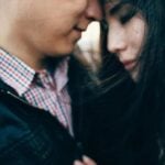 Man and woman forehead to forehead as a symbol of love or lust