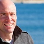 Confident man smiling and staring into the camera