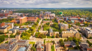 A city view of Ann Arbor, showing houses and green spaces.
