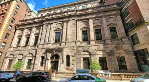 Athenaeum Boston, a historic building with cars in front of