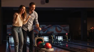 A couple bowling on a date.