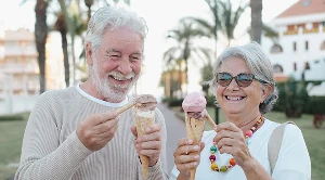 A couple enjoying ice cream together.