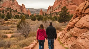 A couple walking the garden of the gods in Colorado Springs.
